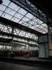 The interior of Waterloo Station near sunset with some fluffy pink clouds that don't quite seem to come through (55kb)